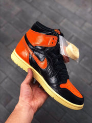 Air Jordan 1 Retro High OG Black and Orange Sneakers